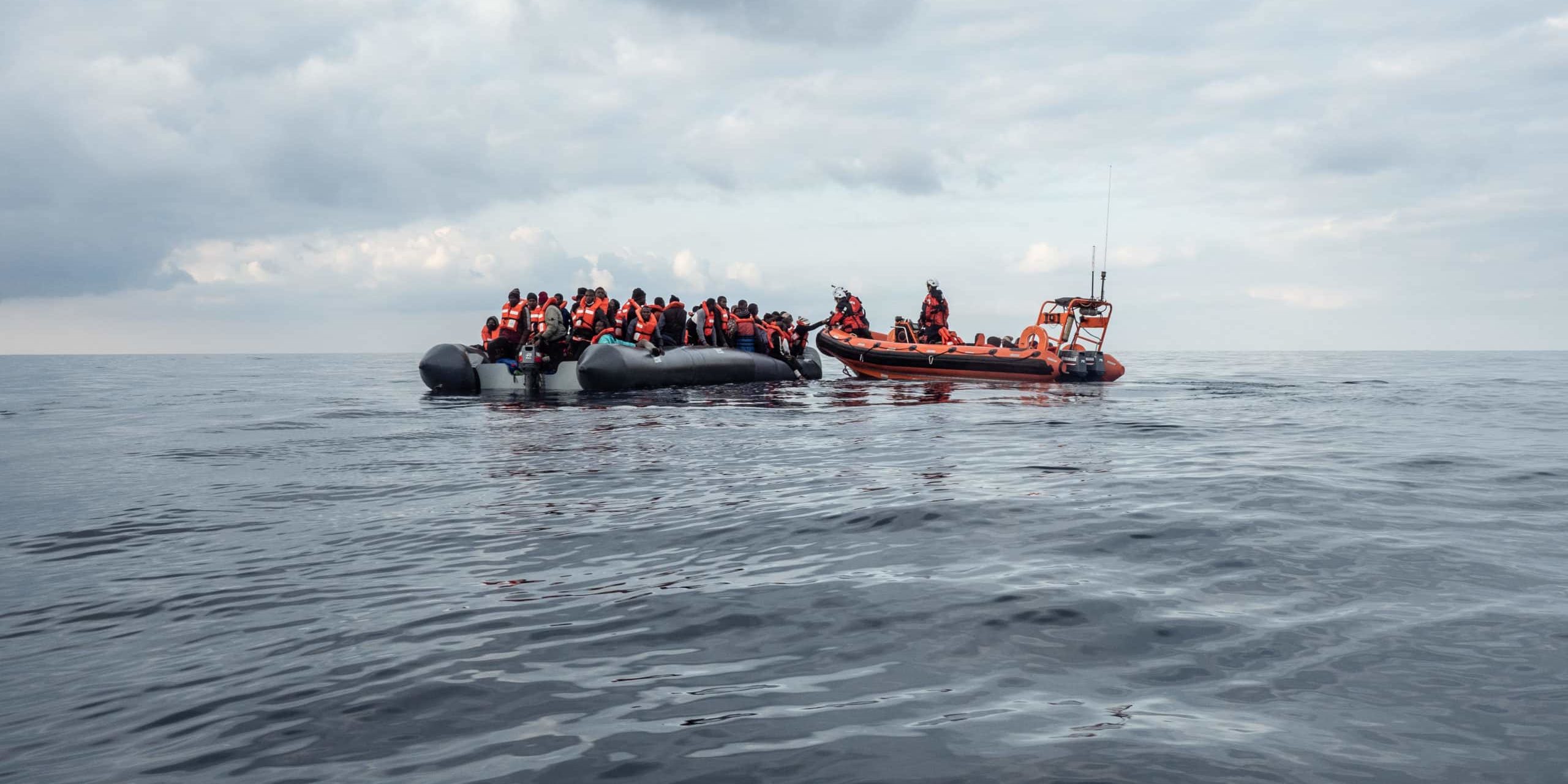 February the 27th, SAR zone. Rescue of 102 people from deflating rubber boat. The Sea-Watch crew rescues a boat in distress