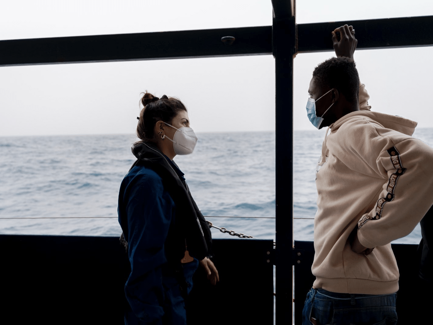 Rachele talking to a guest on board the Sea-Watch 3 in 2022