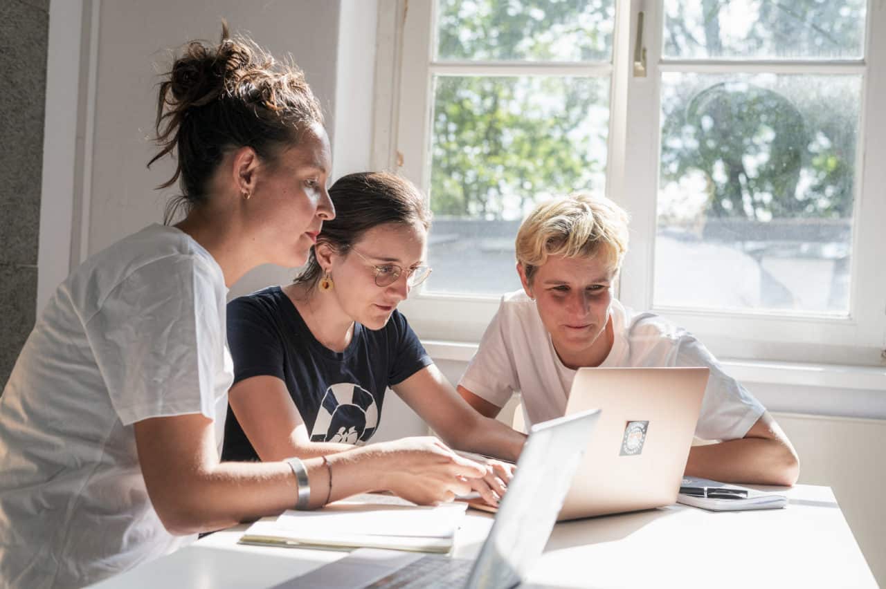Sea-Watch Team of three working together in our Berlin office